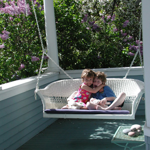 kids on a wicker swing